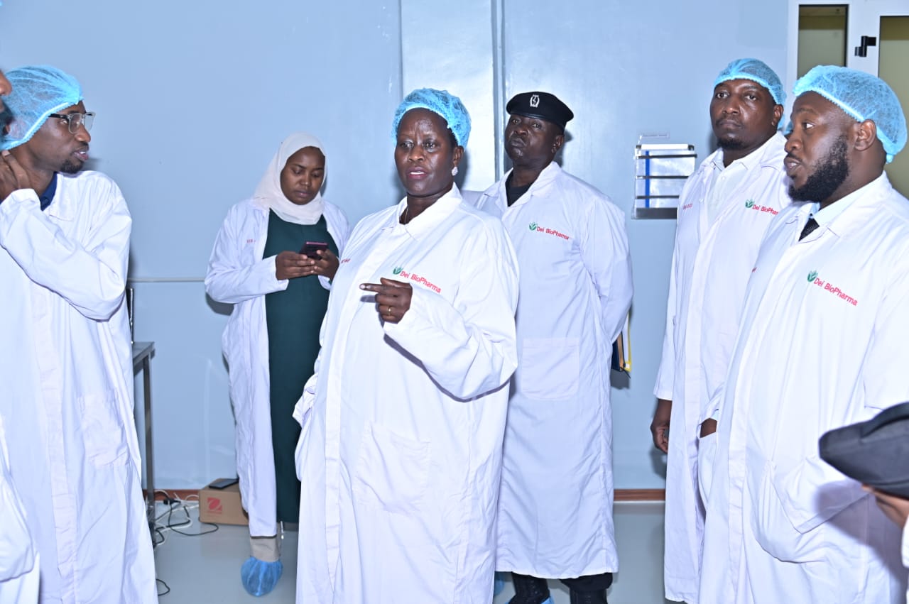 Minister of State for Economic Monitoring Sandra Alum (left) inspects one of the production lines at Dei BioPharma's manufacturing facility during a visit. (Courtesy photo)