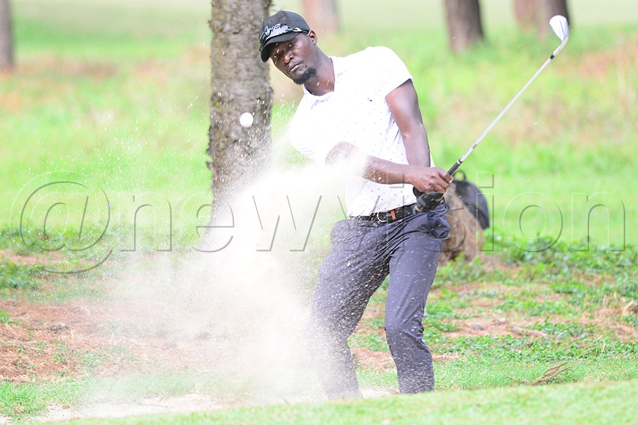 Abraham Ainamani chips from a bunker on hole 17 on the Entebbe course. Photo by Michael Nsubuga