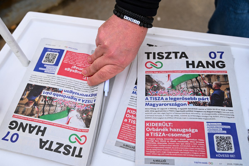 (FILES) The opposition TISZA party's newspaper TISZTA Hang (Clean Voice) is on display at an electoral campaign booth in the streets of Budapest on February 14, 2026, two months ahead of the general election. (AFP)