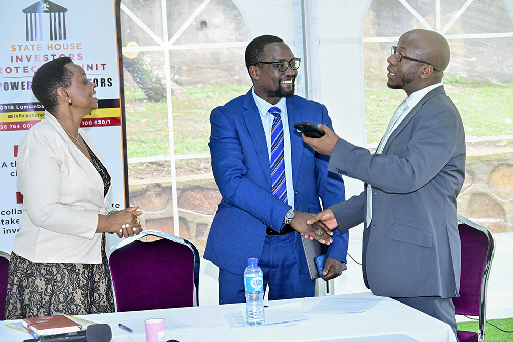 (left - right) The State House Investors Protection Unit (SHIPU) Col. Edith Nakalema, Makerere University College of Health Sciences (MakCHS) Principal Assoc. Prof. Bruce Kirenga and National Environment Management Authority (NEMA) Executive Director Barirega Akankwasah having a chat during the Leaders of Government Agencies meeting to strengthen collaborative efforts to promote accountability and social economic development of Uganda at the SHIPU Headquarters in Nakasero, Kampala on August 26, 2026. 