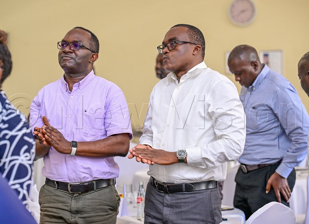 New Vision editors Steven Matege (left) with Arthur Baguma (right).