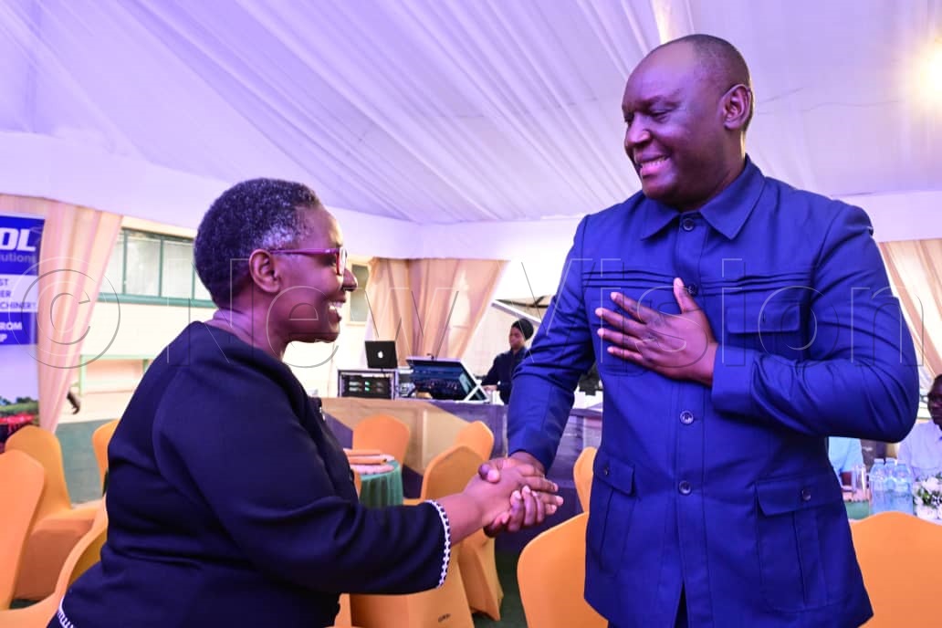 EIC Barbara Kaija greeting Med Mwiri from ENGSOL.