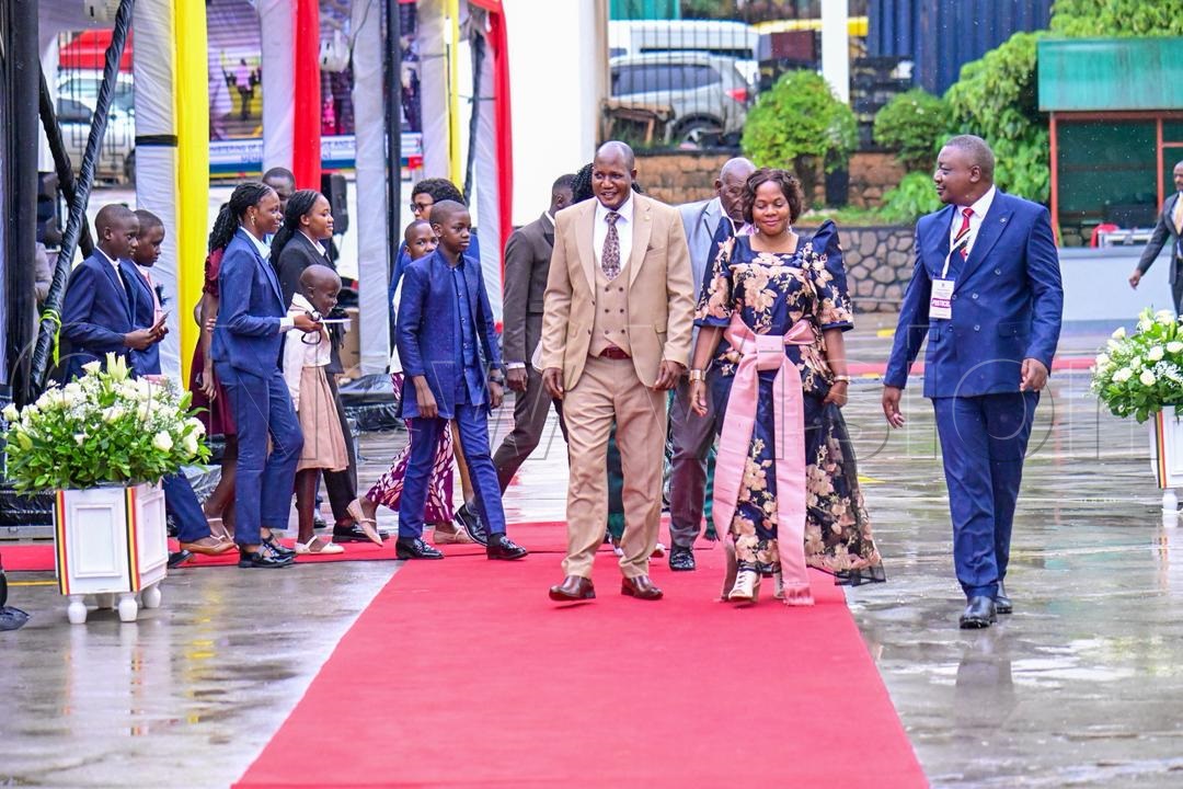Stephen Kisa arrives with family.