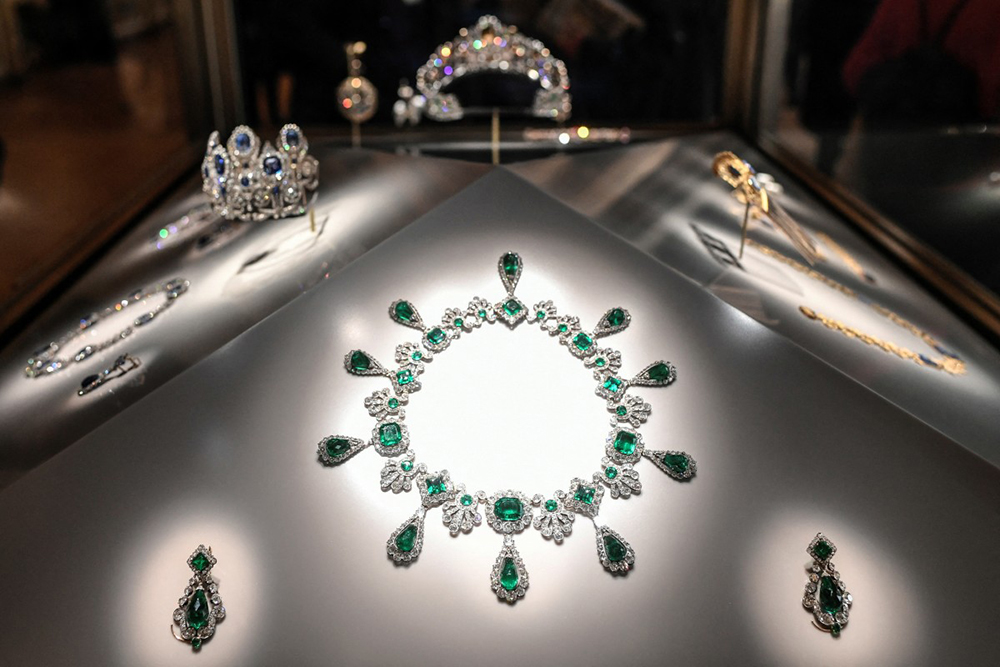 This photograph shows "Collier et boucles d'oreilles de la parure d’émeraudes de l'impératrice Marie-Louise" (necklace and earrings of the set of jewelry of Empress Marie-Louise) displayed at Apollon's Gallery on January 14, 2020, at the Louvre museum in Paris after the reopening of the Gallery following ten months of renovations.