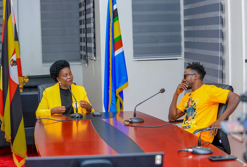 Commissioner of the National Patriotism Corps (NPC), Hellen Seku, while hosting local artiste Patrick Mulwana, popularly known as Alien Skin, on the Patriotism Conversations podcast on Monday, December 22, 2025. (Credit: NSPC)