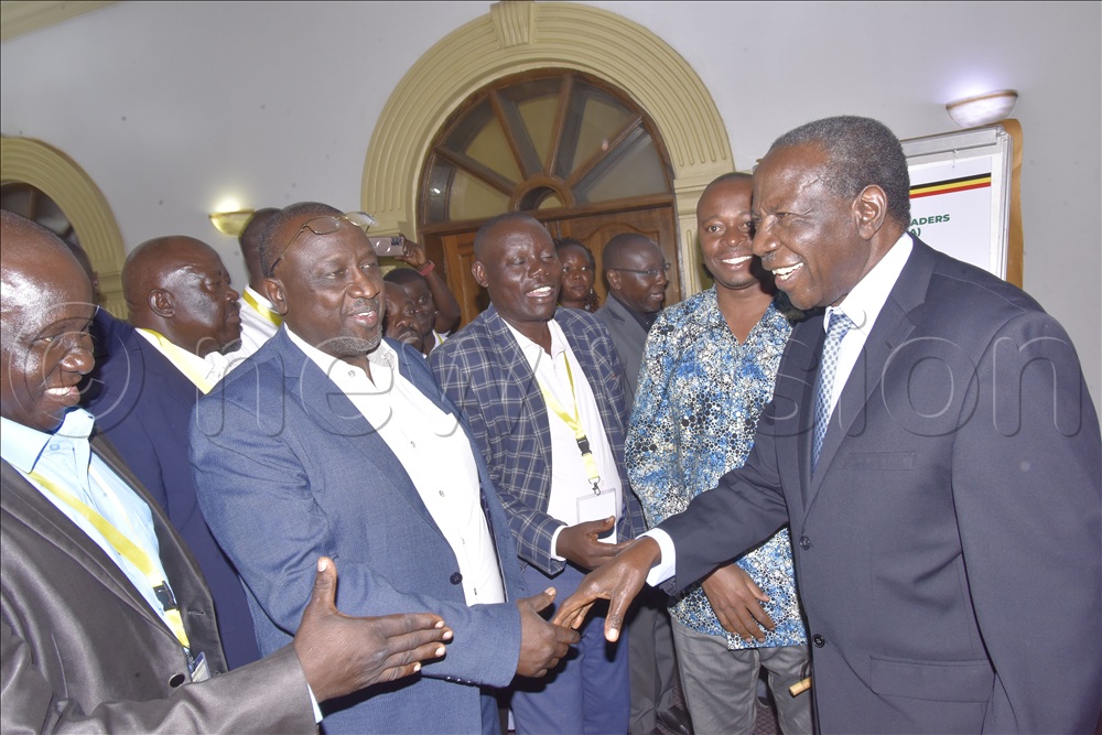  Finance Minister Matia Kasaija (right) with some of the members of the business community at Grand Imperial Hotel.