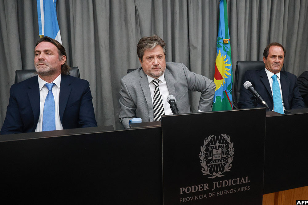 Judges Alberto Ortolani (L), Alberto Gaig (C) and Pablo Rolon (L) are seen at a courthouse during a preliminary hearing in a trial over Diego Maradona's death in San Isidro, outskirts of Buenos Aires on April 14, 2026