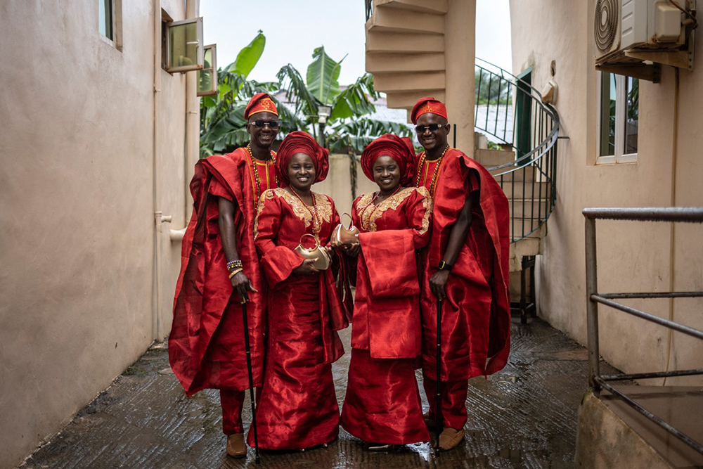 Kehinde Oguntoye (L), Kehinde Adediran (2nd L) Taiwo Adediran(2nd R) and Taiwo Oguntoye (R) poses for a photograph ahead of their traditional wedding ceremony in Ibadan, on June 19, 2026. Two brides in identical white dresses. 