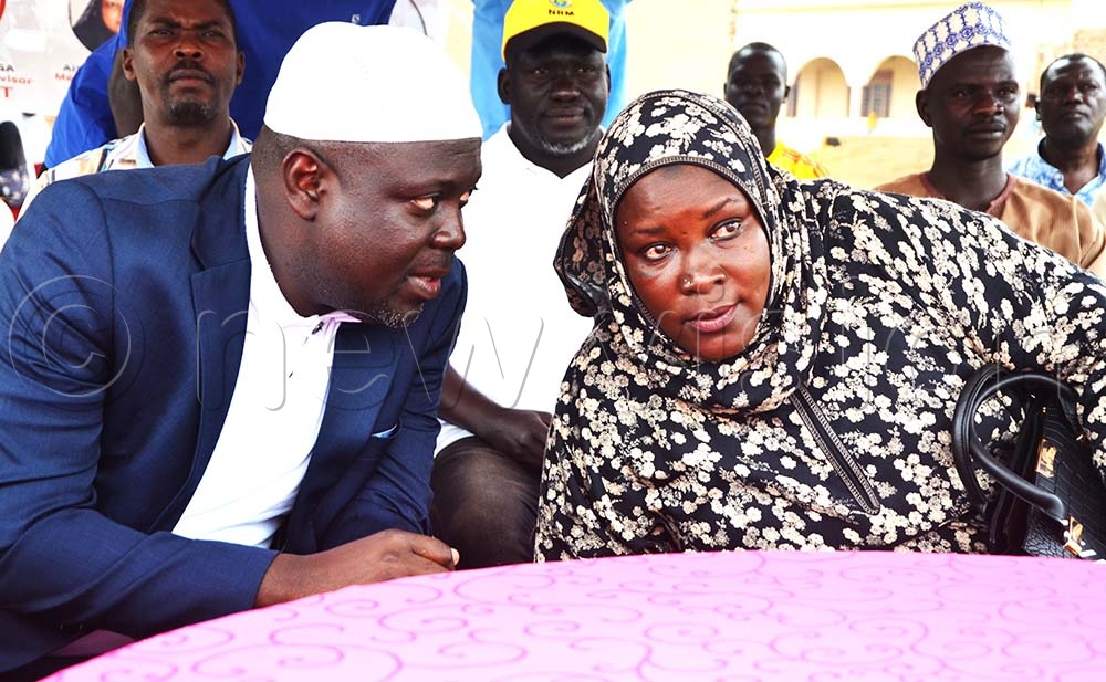 Kirunda interacts with Aisha Neumbe Among, a member of the UMSC General Assembly, during the launch. (Credit: Delux Emmy Alomu)