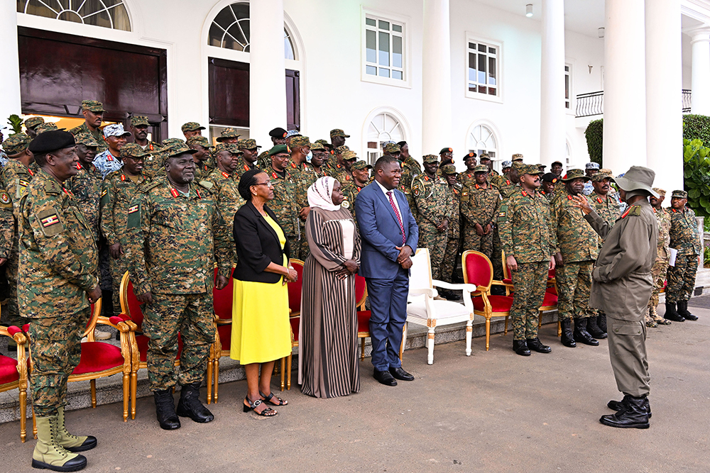 President Museveni (R) interacts with members of the UPDF Military High Command after a meeting at State House Entebbe on Tuesday, Feb. 24, 2026. (PPU Photo)