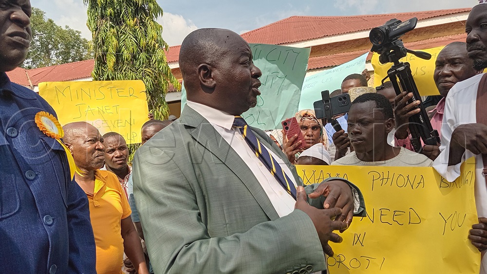 Soroti City RCC John Michael Okurut at the fore front addressing the Muslim community around his office. (Credit: Juliet Akello)
