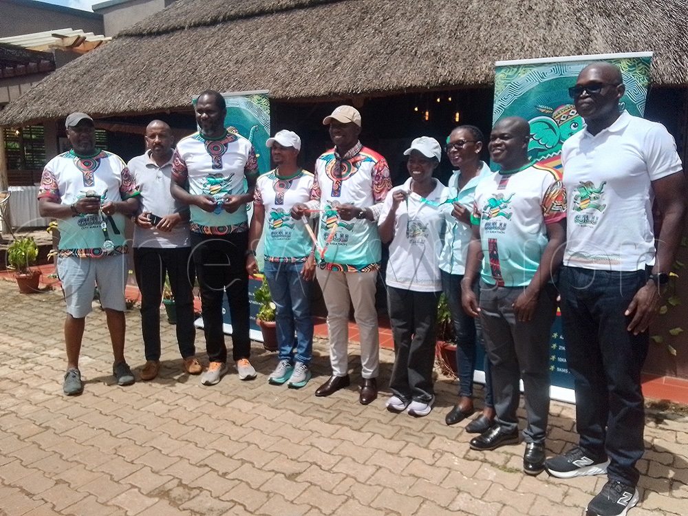 Francis Gimara together with the organizing committees of the 2026 Gulu City Marathon pose for a photo at the Gulu City Inn Hotel after launching the event. (Photo by David Magere)