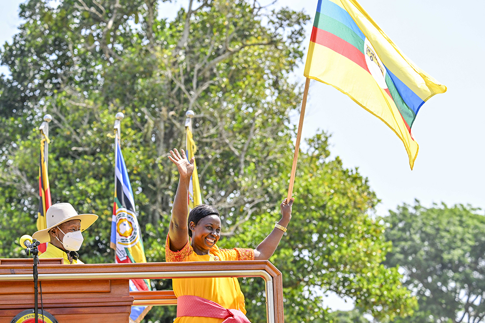 NRM party flag-bearer Idah Nabayiga for Kalangala Woman MP waving the party flag after receiving it from the president. (PPU)