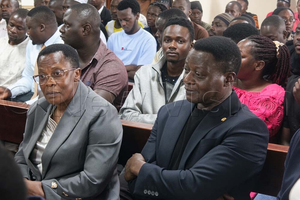 Hon. Bakireke Betty Nambooze with her husband attending the court proceedings. (Credit: Eric Yiga)