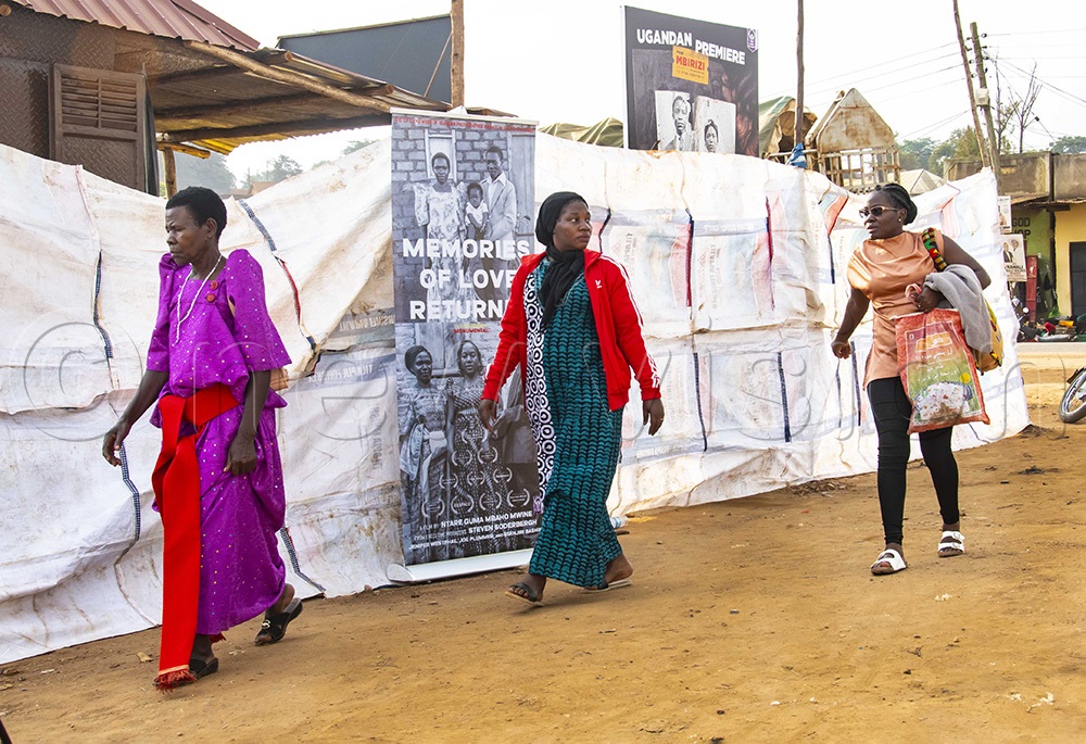 There was no red carpet - Kibaate's family members arrived for the premiere in Mbirizi. (Photo by Kalungi Kabuye)