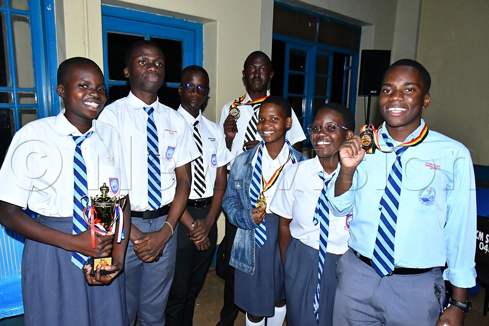 Students of Jinja Secondary School display their trophy after finishing as second runners-up in the 11th Kiira/Busoga Regional Speech and Debate Qualifiers at Busoga College Mwiri in Jinja District on July 12, 2026. (Photo by Donald Kiirya)