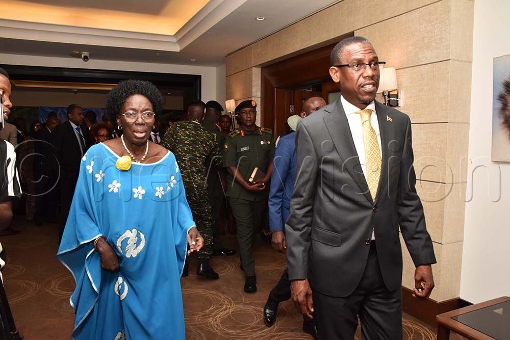 Rebecca Kadaga, the first deputy prime minister and Kiryowa Kiwanuka, the Minister of Defense and Veterans affairs sharing a light moment shortly after a meeting of the 36th ordinary policy organs meeting of EASF at Sheraton Hotel on August 14. (Credit: Simon Peter Tumwine)