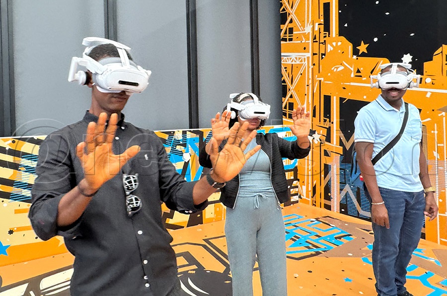 Ugandans trying out A virtual reality headset at the China International Fair for Trade in Services