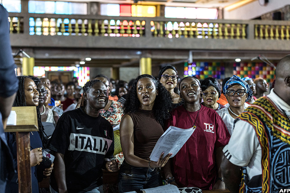 Members of the choir rehearse ahead of Pope Leo XIV’s visit at Saint Joseph Metropolitan Cathedral in Bamenda, on April 12, 2026
