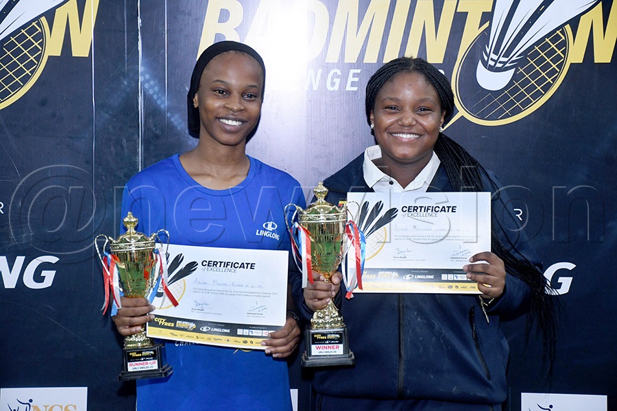 Adlah Muleme (left) and Divine Mwesigwa pose with their women singles U-15 prizes after the City Tyres-Linglong championship at the Lugogo Indoor Arena, October 18, 2026. Photo by Michael Nsubuga