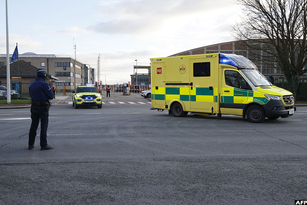 An ambulance leaves the Melsbroek military airport in Moelsbroek on January 2, 2026, as Belgium has offered its assistance to Switzerland after the deadly fire, by taking in four injured people to provide them with specialised medical care.