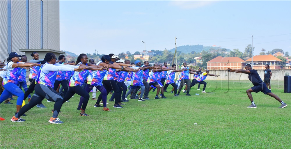 NMS staff engaging in drills for the 2025 cancer run during the Thursday activation at the main warehouse in Kajjansi town council.