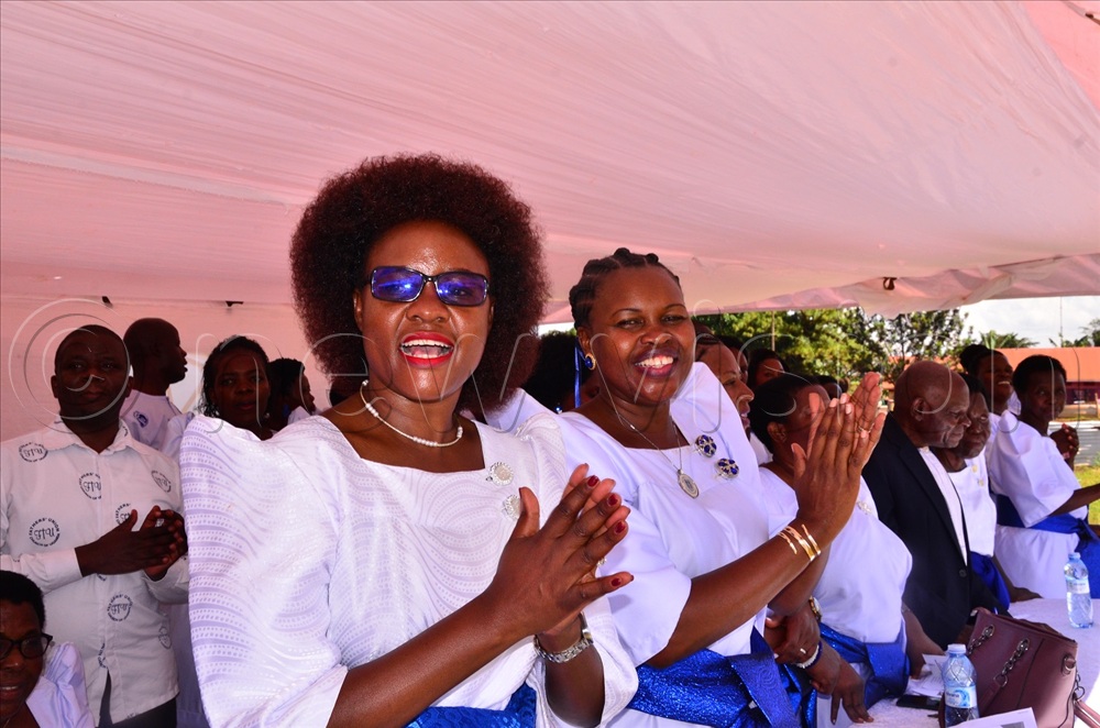 Jinja city woman legislator Sarah Lwansasula (L) and Loy Egesa, the chairperson of Mother's Union of the Deanery during the St. Mary's Day celebrations at the Cathedral on Sunday.