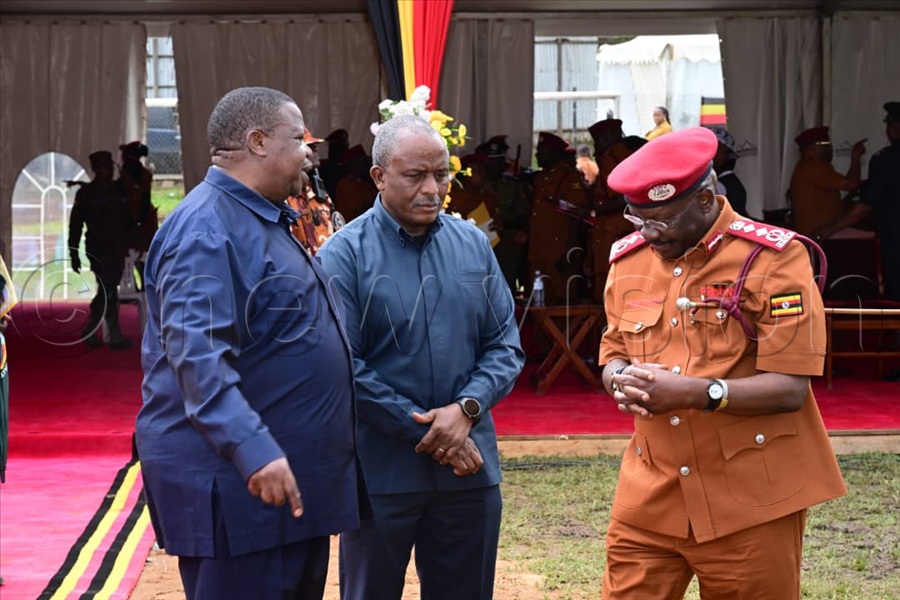  The Commissioner General of Prisons Dr. Johnson Byabashaija (R) greets General Kahinda Otafiire, the Minister of Internal Affairs.
