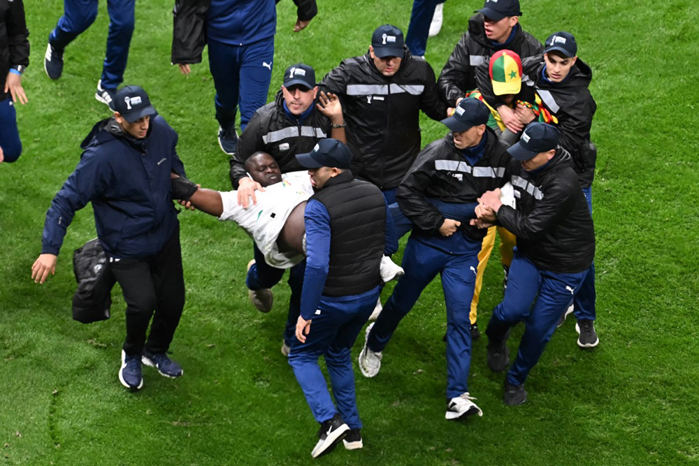 Supporters of Senegal are evacuated by stewards during the Africa Cup of Nations (CAN) final football match between Senegal and Morocco at the Prince Moulay Abdellah Stadium in Rabat on January 18, 2026. (Photo by Paul ELLIS / AFP)