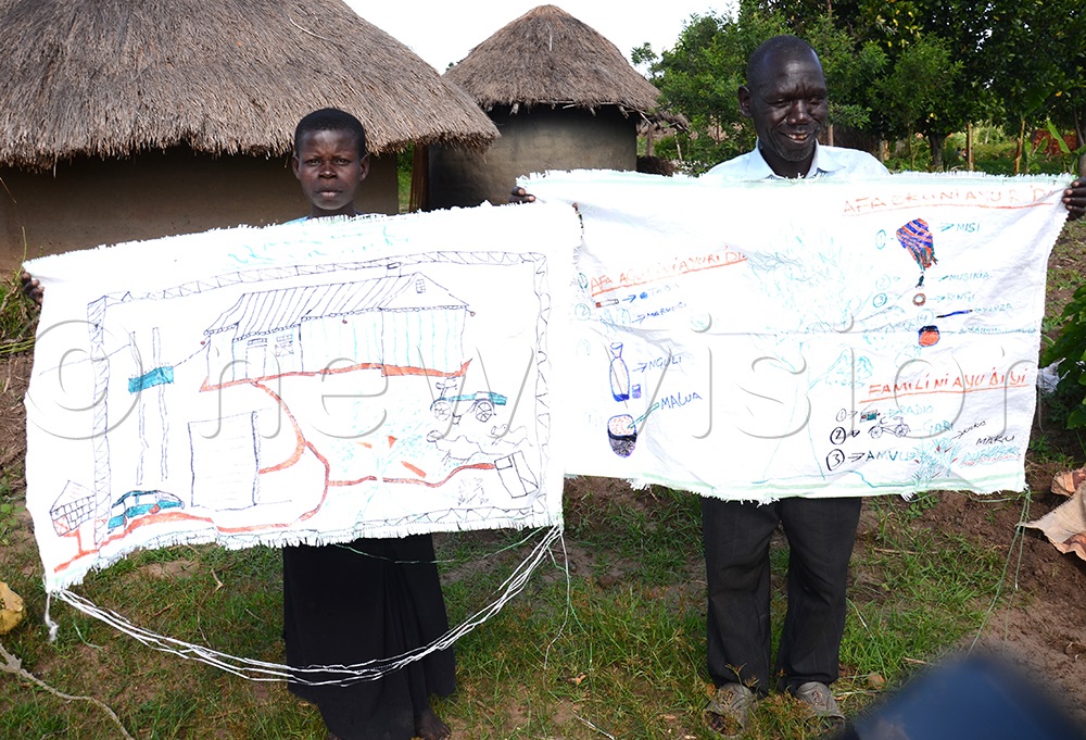Ezama Ronald, a visually impaired beneficiary of We are able and the wife displays the vision road journey prepared after attaining the empowerment skills as a family. (Credit: Robert Adiga)