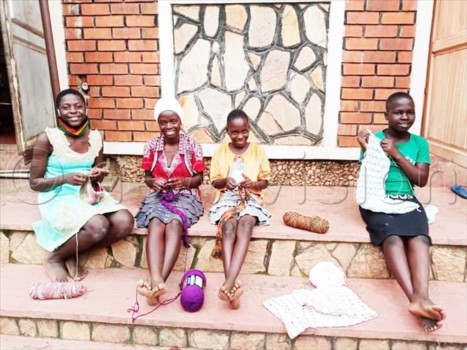 Nakiranda (second left) doing crotchet with other girls.