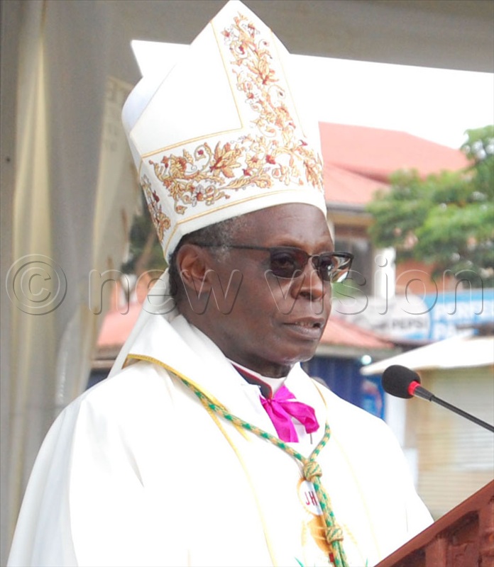 Bishop Lawrence Mukasa delivers his homily during mass. 