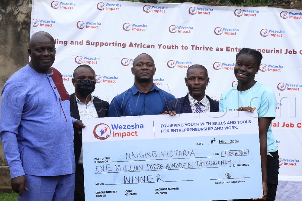 Winning innovators from vocational institutions received dummy cheques for their outstanding projects during the  Wezesha Awards ceremony 2025. (Photo by Richard Ategeka)