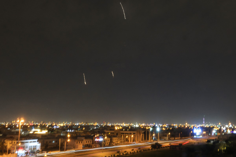 Missiles are seen in the skies over Doha on March 3, 2026. Qatar's military intercepted two ballistic missiles early in the morning of March 3, the country's defence ministry said in a statement, after AFP reporters heard loud explosions across Doha. (AFP)
