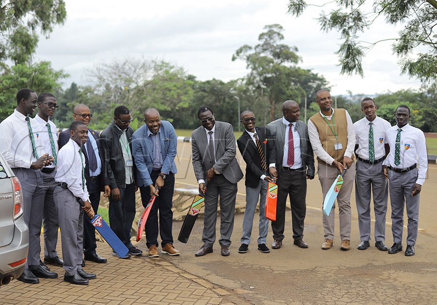 Namilyango College headteacher Constantine Mpuuga (C) and Uganda Cricket Association chairman Jackson Kavuma with the staff, old boys and students to launch Cricket at Namilyango College. PHOTO: Johnson Were