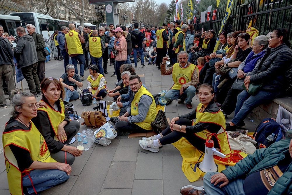 Members of education unions stage a sit-in to protest school shootings in front of the Ministry of National Education headquarters in Ankara, on April 15, 2026. (Photo by Adem ALTAN / AFP)