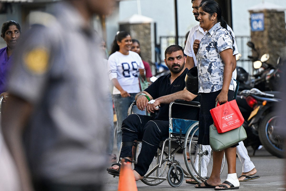 An injured Iranian sailor arrives to receive treatment at the Karapitiya hospital in Galle on March 4, 2026 after his frigate, IRIS Dena sank off Sri Lanka's coast. (AFP)