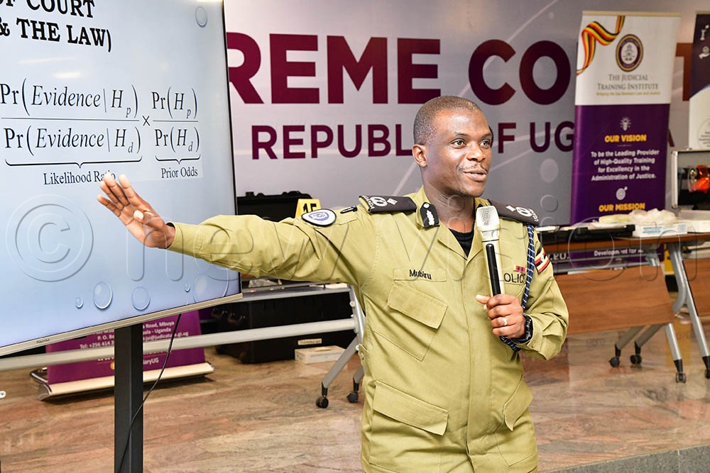 Andrew Mubiru, Director of Forensic Services, Uganda Police Force making a presentation during the criminal procedures training at Supreme Court conference hall. (Credit: Mpalanyi Ssentongo)