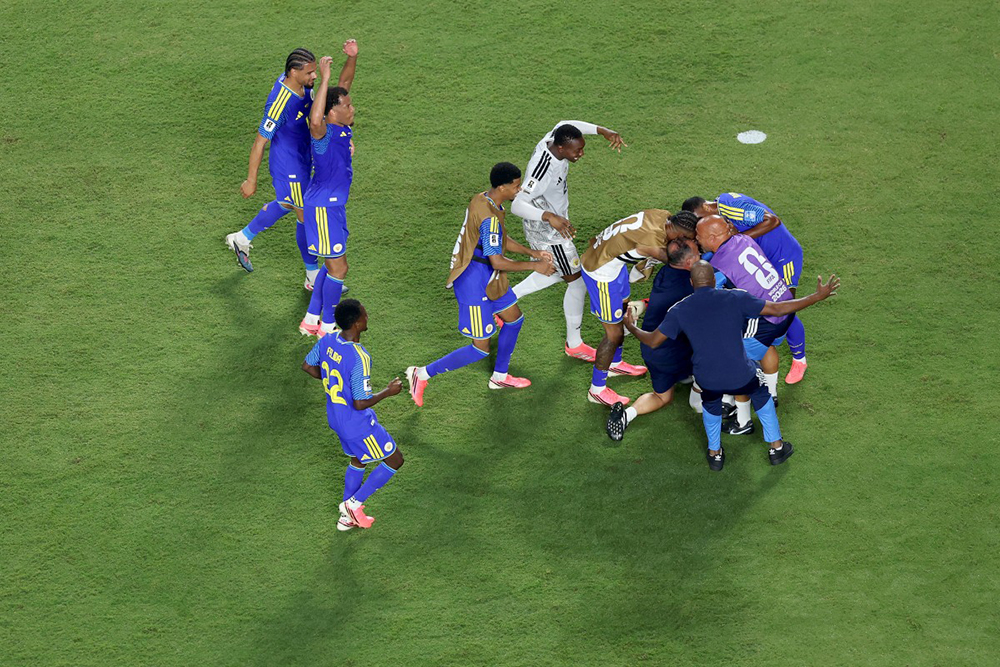 Eloy Room #1 (obscured) of Curacao is embraced by teammates the 0-0 draw during the FIFA World Cup 2026 Group E match between Ecuador and Curacao at Kansas City Stadium on June 20, 2026 in Kansas City, Missouri.