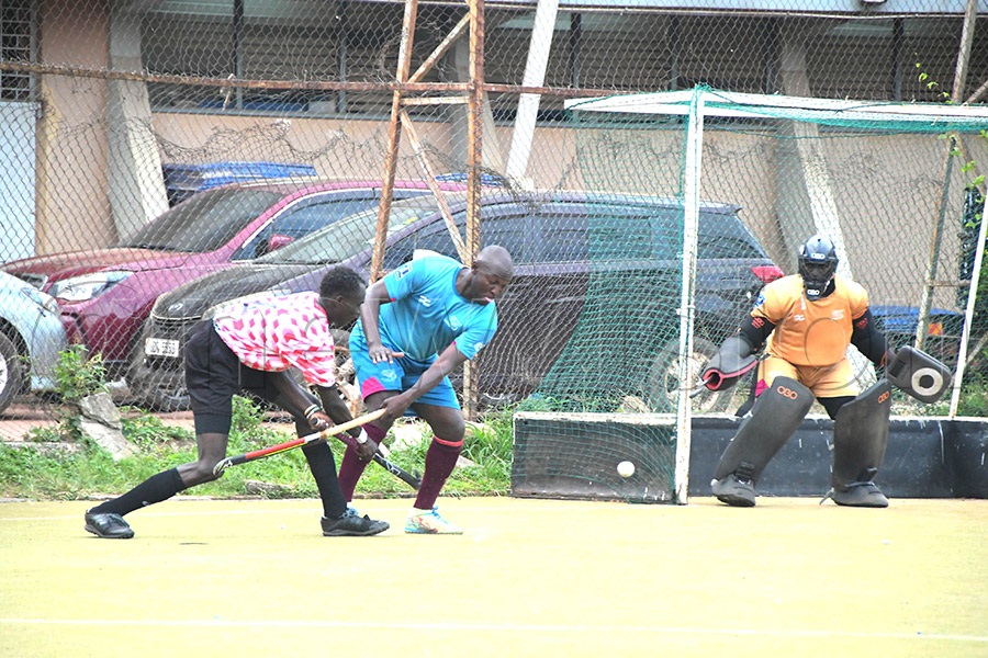 A Thunders player challenges an Originals Hockey Club opponent during a league game at Lugogo on May 17. Thunders won 3-0. (Photo: Silvano Kibuuka)