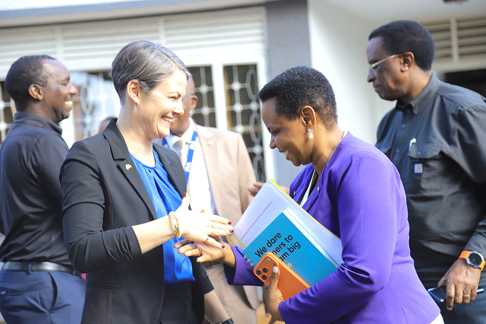 Nakalema sharing a moment with Signe Winding Albjerg.