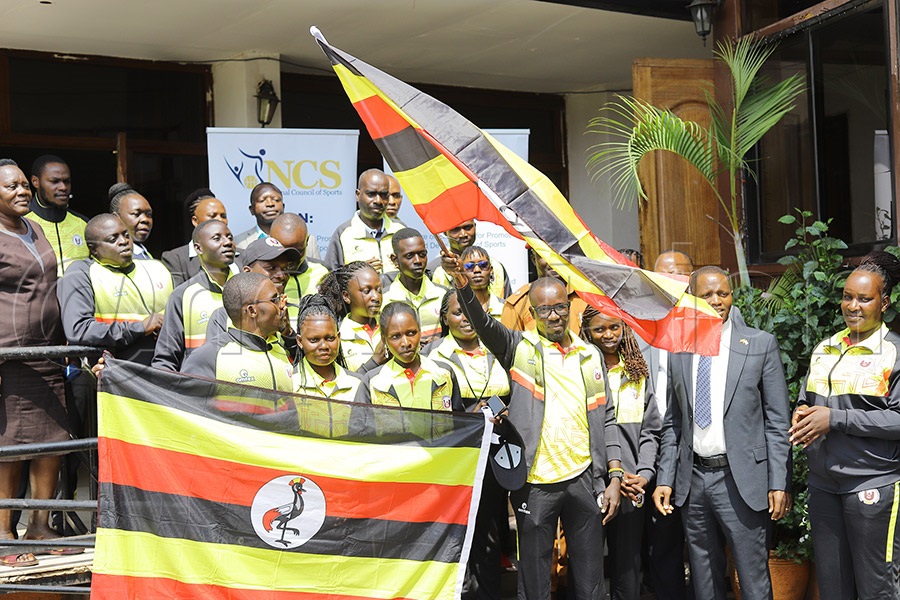 National Council of Sports Assistant Secretary Milton Chebet flags off Team Uganda as they depart for the World Cup in Malaysia. PHOTO: Johnson Were