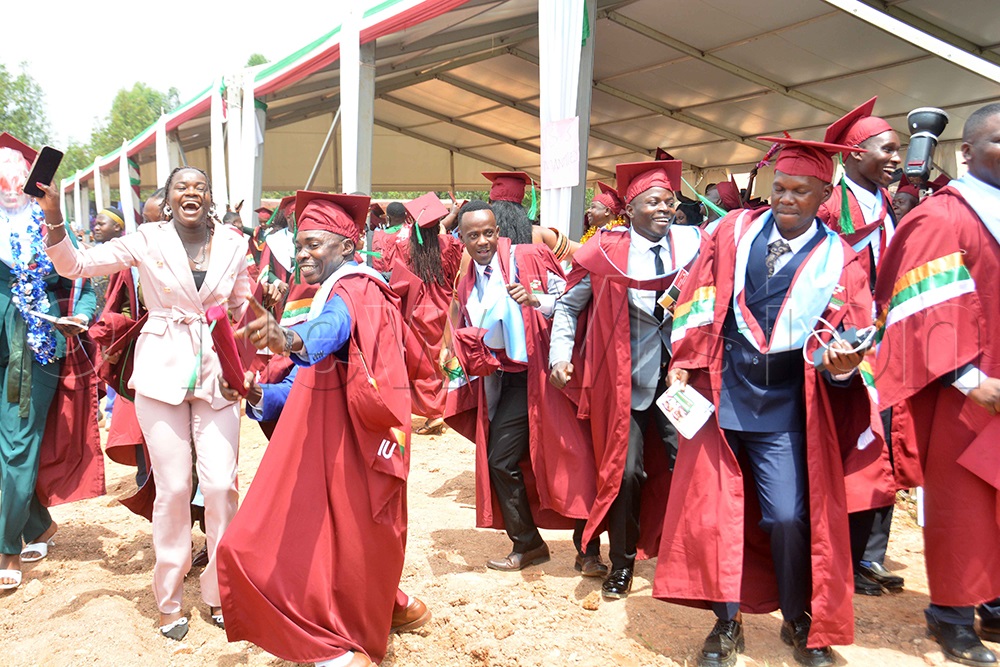 The graduates of Metropolitan International University dancing during the 8th graduation ceremony at the university campus in Mbarara City on Friday, Feb. 27, 2026. (Photo by Francis Emorut)