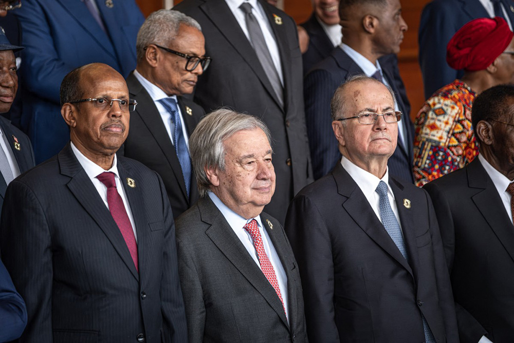 Mahmoud Ali Youssouf (L), Chairperson of the African Union Commission, Antonio Guterres (C), Secretary-General of the United Nations, and Mohammad Mustafa (R), Prime Minister of the State of Palestine, pose for a family photo during the 39th Ordinary Session of the Assembly of the African Union at the AU Headquarters in Addis Ababa on February 14, 2026. (Photo by Marco Simoncelli / AFP)