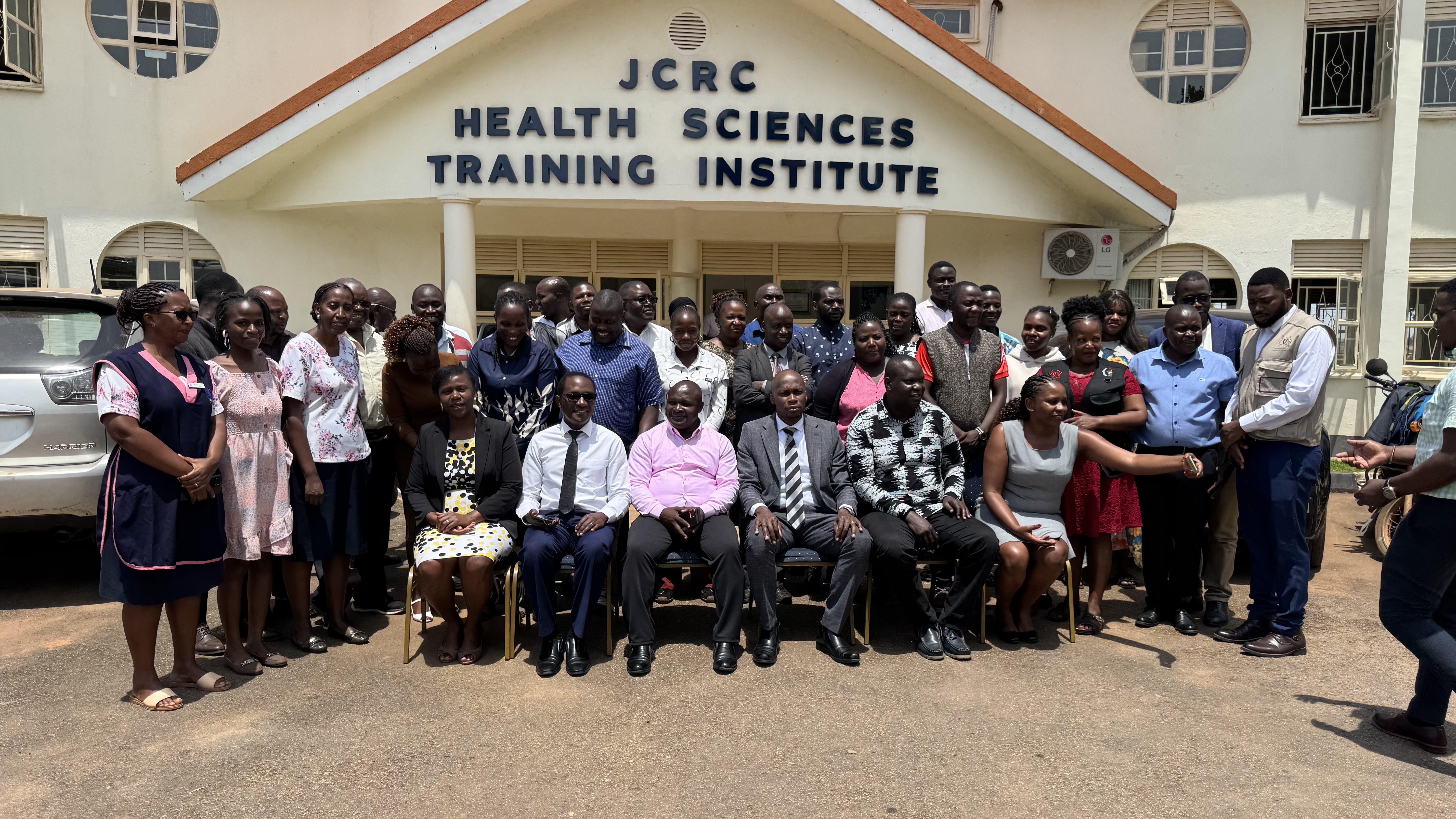 Health stakeholders from JCRC, Wakiso district and Kampala pose for a photo after the close out meeting of the project