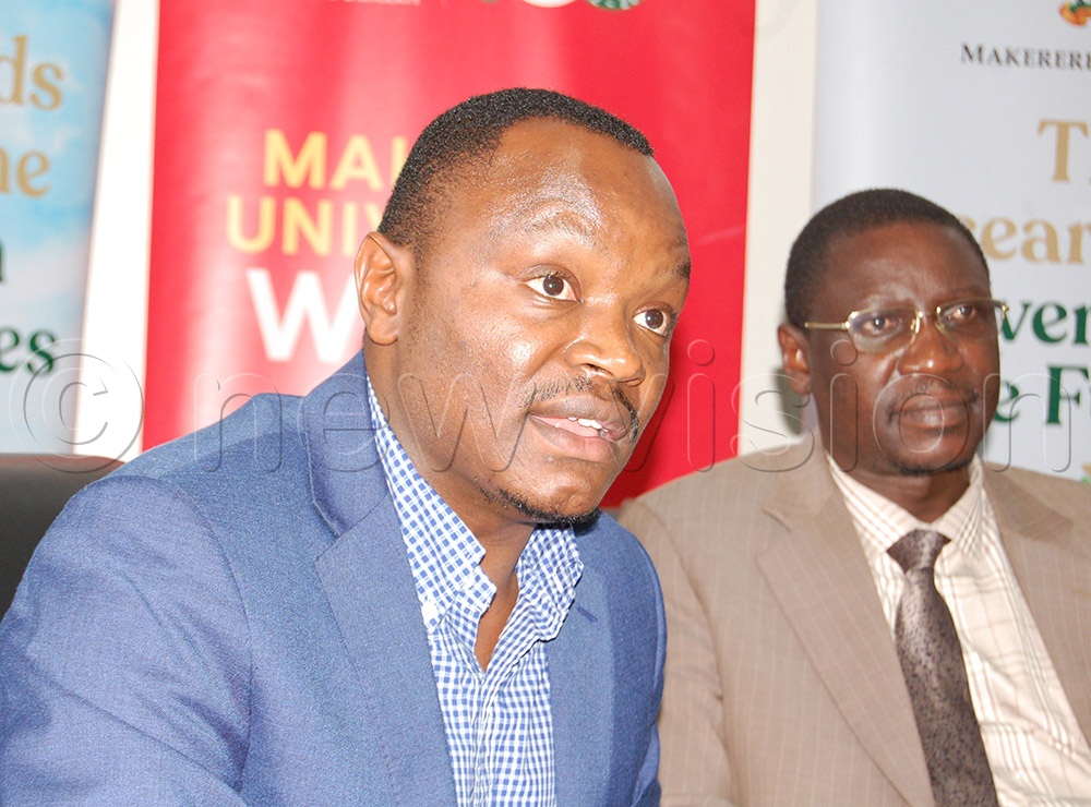 The Manager, International Relations Office, Mathias Ssemanda (left) delivers his message during the press conference. With him is the university's Director of Quality Assurance. Dr. Cyprian Misinde. (Credit: Mathias Mazinga)