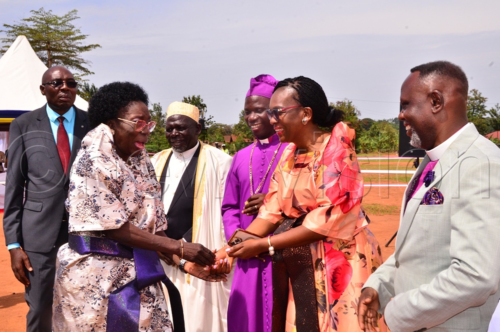 A seemingly jovial Kadaga shakes hands with Claire Lubaale, flanked by her husband, Rt. Rev. Prof. Grace Lubaale, and other religious leaders as they welcomed her to Mayuge on Sunday. (Photo by Jackie Nambogga).