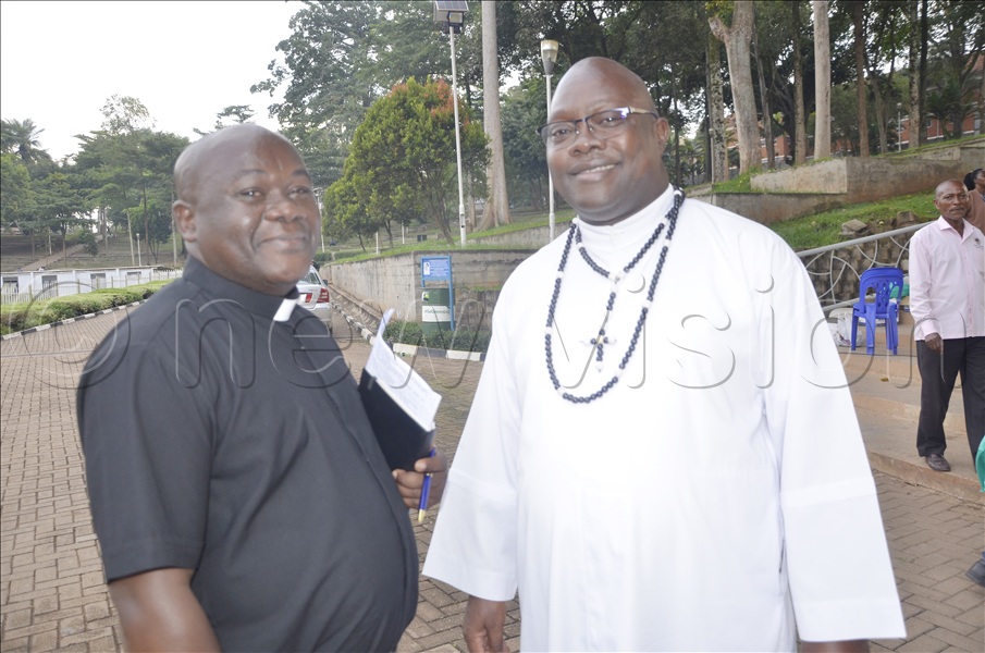  In charge of Liturgy (choirs), Fr Dr Vincent Muhindo (Rector of Kinyamaska Natinal Sseminary) chats with the Shrine Rector of Namugongo, Fr Vincent Lubega after the meeting at Namugongo on May 7, 2026. (Credit: Juliet Anna Lukwago)