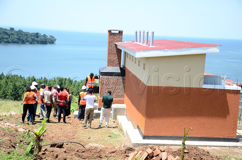 Officials inspecting a Very Improved Pit Latrine constructed at St. Victor Mulabana Primary School. This was during a joint supervision of activities and infrastructure under the Heroes for Gender Transformative Action program in Kalangala district on February 4, 2026. (Credit: Lawrence Mulondo)