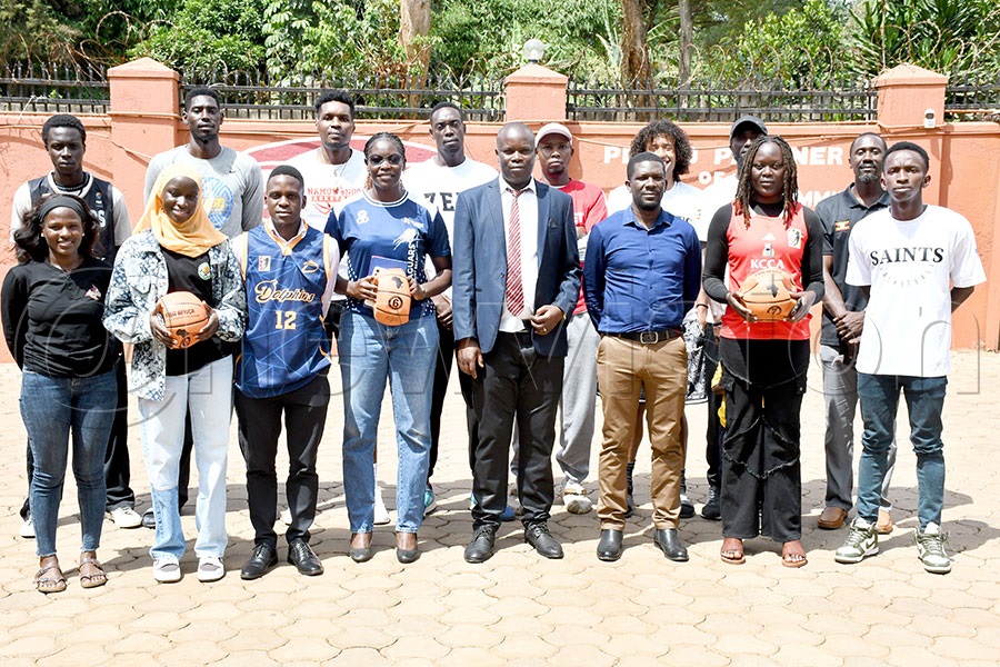 Team representatives pose with FUBA officials NBL committee Chairman Fredricks Freedom Owora (center) and Arnold Katabi (2nd right) after the pre-match press conference at the UOC offices. Photo by Michael Nsubuga